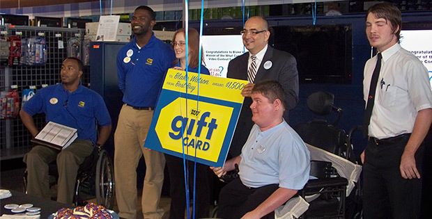 Me receiving over-sized gift card from Best Buy.