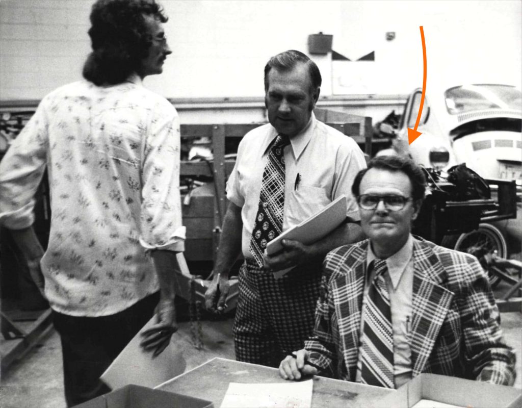 Black and white photo of my grandfather sitting at a work desk in a shop. Looking fly because it was the sixties or seventies.