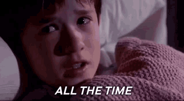 Animated gif of the kid from The Sixth Sense laying in his bed saying, 'all the time.'
